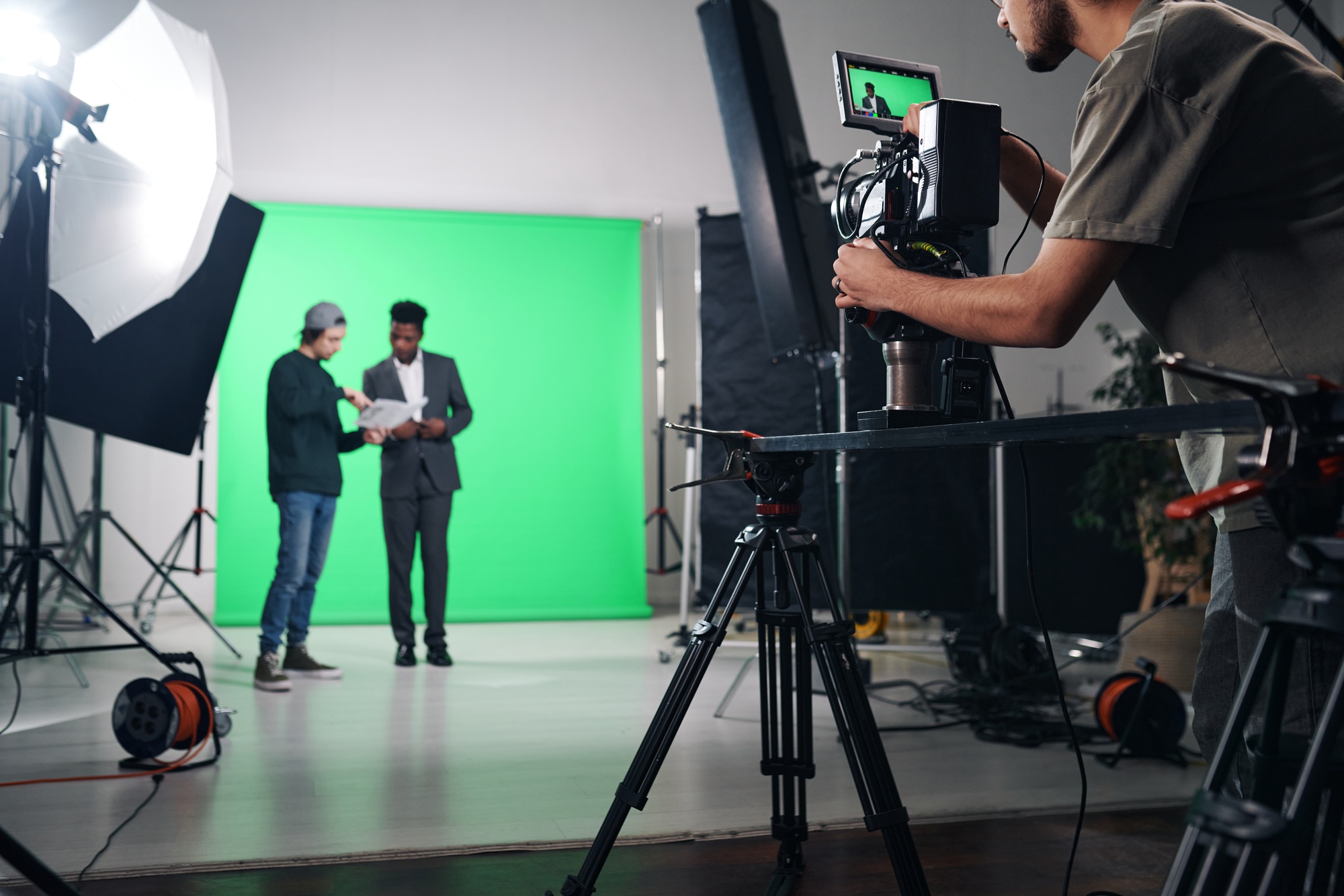 Cameraman shooting TV program in studio